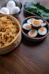 Close-up of dim sum setup sushi,noodles and egg