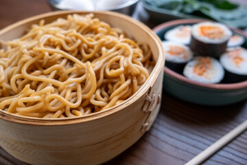 Close-up of dim sum setup sushi,noodles and egg