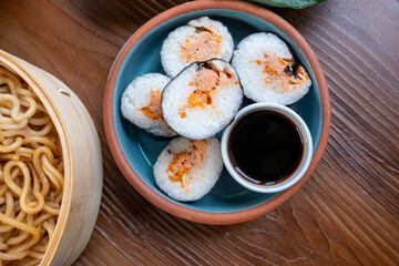 Close-up of dim sum setup sushi,noodles and egg