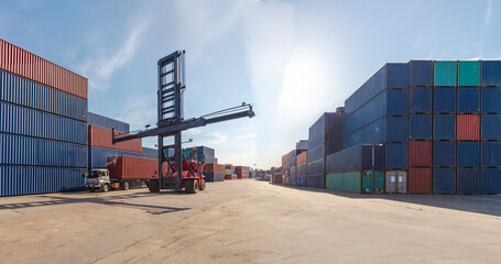 Containers of cargo being loaded at the port onto a freight ship