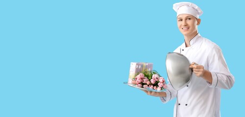 Male chef with gift and tulips on light blue background with space for text. International Women's Day celebration