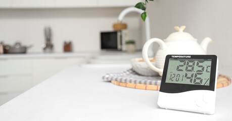 Digital hygrometer on counter in kitchen, closeup