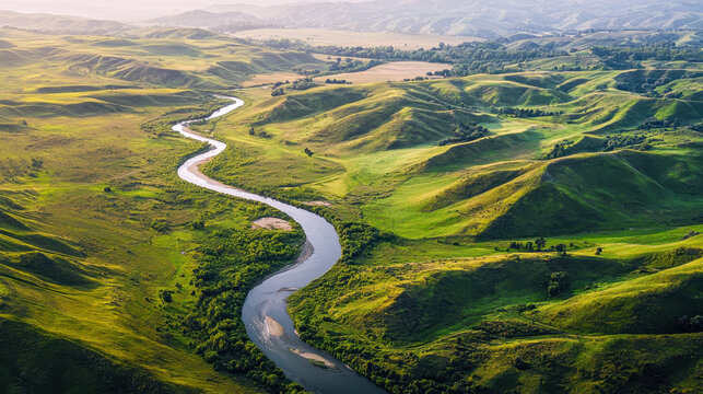 Stunning Aerial Photography of Meandering River and Rolling Hills Amidst Lush Greenery in a Picturesque Rural Landscape &ndash; Perfect for Tranquil Nature Exploration and Sustainable Travel