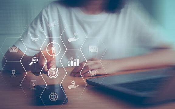 Businesswoman touching on screen to target customer. Target customer, buyer persona, client behavior concept. Marketing plan and strategies. Personalization marketing, consumer centric strategies.