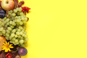 Different fresh fruits on yellow background