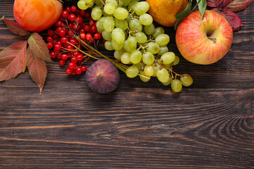 Different fresh fruits on wooden background