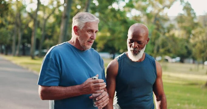 Fitness, senior friends and walk outdoor for body health, wellness discussion or tips for cardio workout. Men, exercise or conversation together at park with smart watch for time, heart rate or steps