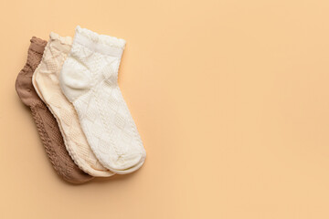 Different basic color socks on beige background