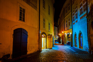 Fototapeta premium Walk in Stare Mesto district in maze of narrow medieval streets, occupied with cafes, restaurants and souvenir stores in Prague, Czech Republic