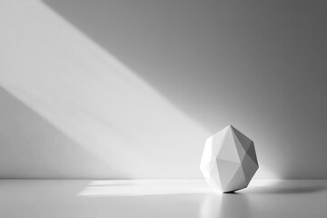 A minimalist scene with a white geometric shape illuminated by sunlight against a white wall.