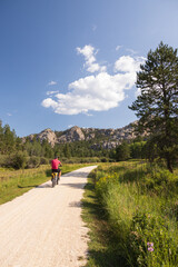 Obraz premium Man riding e-bike on the George S. Mickelson Trail, South Dakota