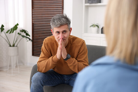 Professional psychologist working with patient in office, closeup