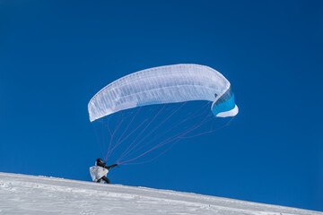 Paraglider Getting Ready for Takeoff