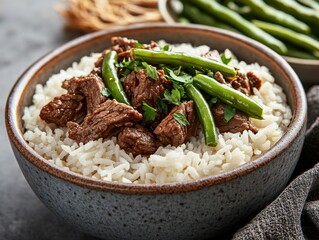 Cooked rice with beef and green beans in a bowl. Steamed white rice mixed with beef and green beans in a ceramic bowl. Emphasizing protein and hearty nutrition. Ideal for food blogs and savory meals.