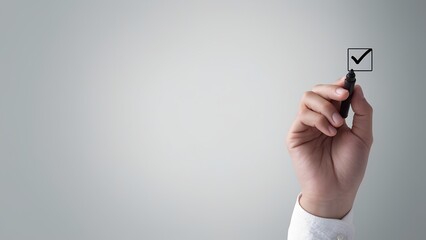 Marking success with a check office setting image of a hand professional environment close-up focus productivity concept