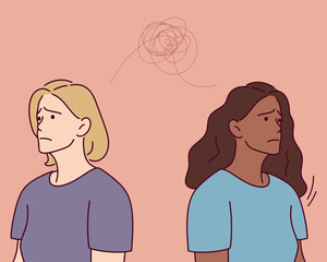  Two young women avoid eye contact, showing emotional distance and sadness. The image represents unresolved issues and tension. LGBT