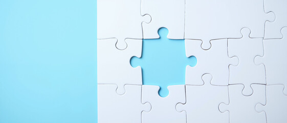 Puzzle pieces with a missing section against a light blue background conveying a sense of incompleteness and the need for resolution in the context of Insurance Policy Reviews