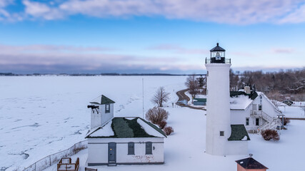Winter aerial view Tibbetts Point Lighthouse on the shore of Lake Ontario, at the entrance of the...