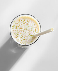 top view of A white nutritional vanilla shake . Clean and modern setup with natural lighting