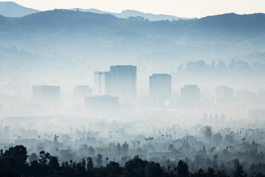Morning fog and Woodland Hills office towers in San Fernando Valley area of Los Angeles, California.