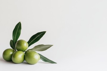 Isolated green olives with leaves on a white background featuring full depth of field