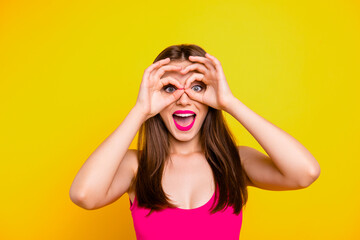 Fun joy people person season sale discount concept. Close up photo portrait of funny funky crazy mad astonished beautiful lady making eyewear fingers hands isolated bright background