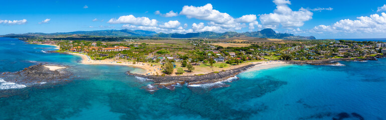 Aerial view of Kauai island's Hawaii coastline with sandy beaches, turquoise waters, rocky...