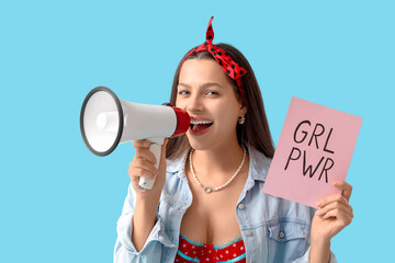 Young pin-up woman with GRL PWR sign and megaphone on blue background. Women's History Month