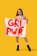 Young pin-up woman with big GRL PWR sign on yellow background. Women's History Month