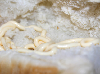 bread with mayonnaise. food with selective focus. details of the inside of the bread with mayonnaise.