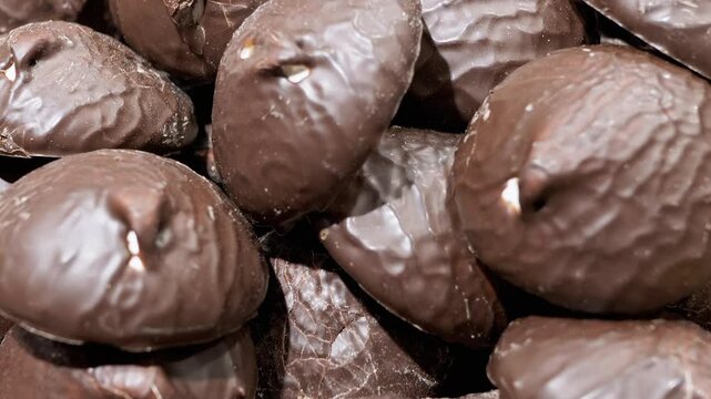 Close up view of chocolate covered marshmallows. This video can symbolize the problem of overeating unhealthy foods and also ilustrate healthy lifestyle or healthy eating habits.