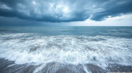 Obraz premium Dramatic Stormy Sky Over Calm Ocean Waves Creating a Natural Background for Various Creative Projects and Commercial Uses