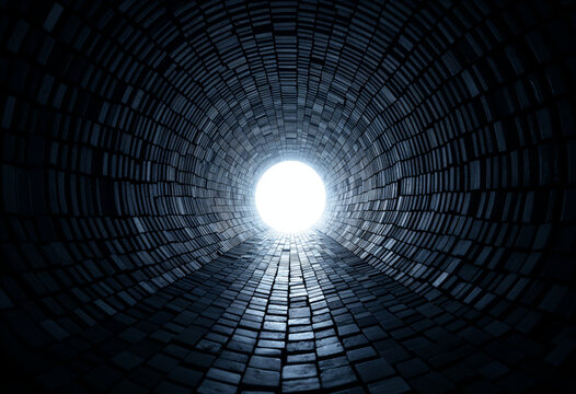 Fototapeta A dark tunnel with a bright light at the end. The path is made of dark bricks leading towards the light. The image evokes hope and a journey towards the future.