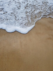 wave on the sand