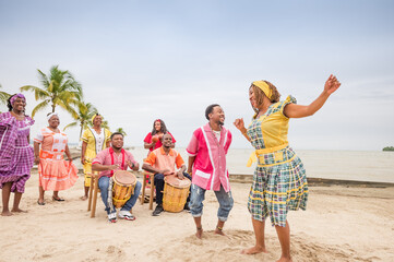 Beautiful Latina girl of the Garifuna ethnic group dances to the rhythm of the music.