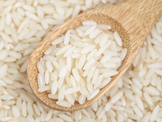 Rice grains in a wooden spoon. Close-up of uncooked white rice grains in a wooden spoon. Emphasizing simplicity and natural materials. Ideal for cooking blogs and ingredient highlights.