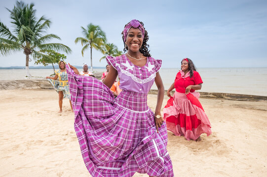 Portrait of a beautiful girl from the Garifuna ethnic group wearing a beautiful traditional costume in lilac color.