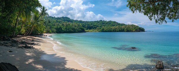 Tropical beach paradise with clear blue water and lush greenery