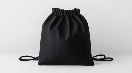Mockup of a black drawstring bag against a white backdrop