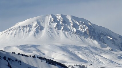 Naklejka premium A majestic snow covered mountain peak isolated
