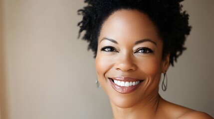 A joyful African American woman radiates happiness, embodying warmth and positivity