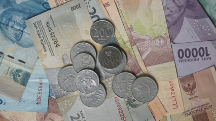 Rupiah banknotes and coins. Money or Currency