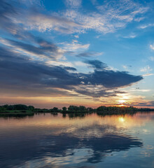 The sky is blue and the sun is setting