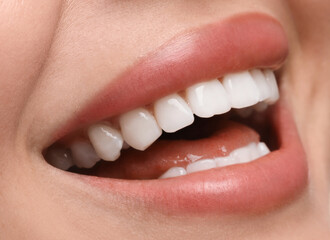 Obraz premium Young woman with healthy teeth and beautiful smile, closeup