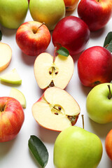 Flat lay composition with whole and cut apples on white background