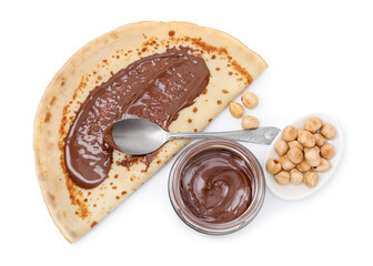 Tasty crepe with chocolate butter and hazelnuts isolated on white, top view