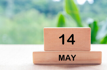 14 May text on wooden blocks with customizable space for text or messages. Month and copy space...