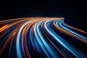 Abstract light trails curve through the night