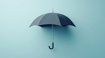 Black umbrella on light blue background