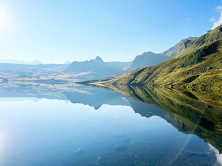 The alpine lake Melchsee or Melch Lake in the Uri Alps mountain massif, Kerns - Canton of Obwalden,...